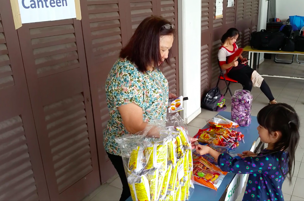 Kids buying snacks using their money