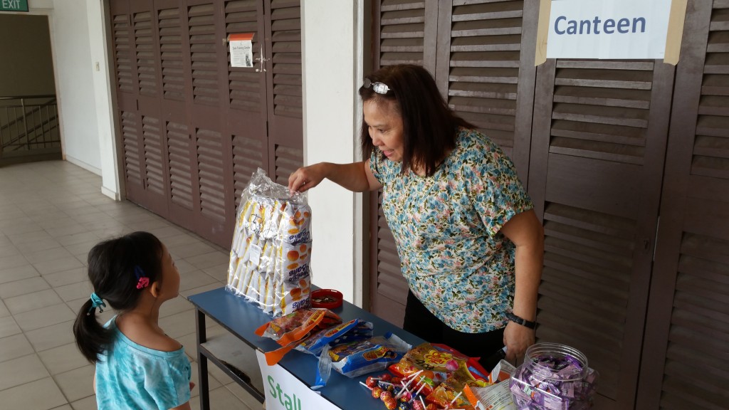 Kids buying snacks using their money