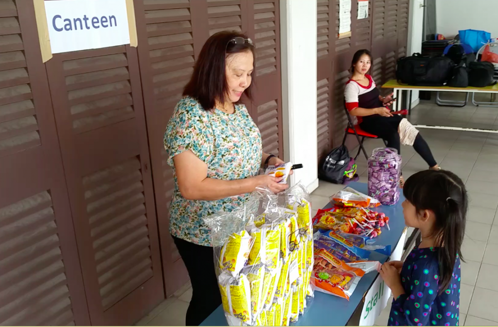 Kids buying snacks using their money